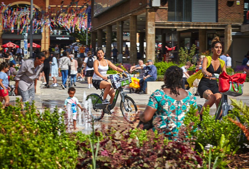 Cycling and shopping in Coventry city centre near ONE Friargate